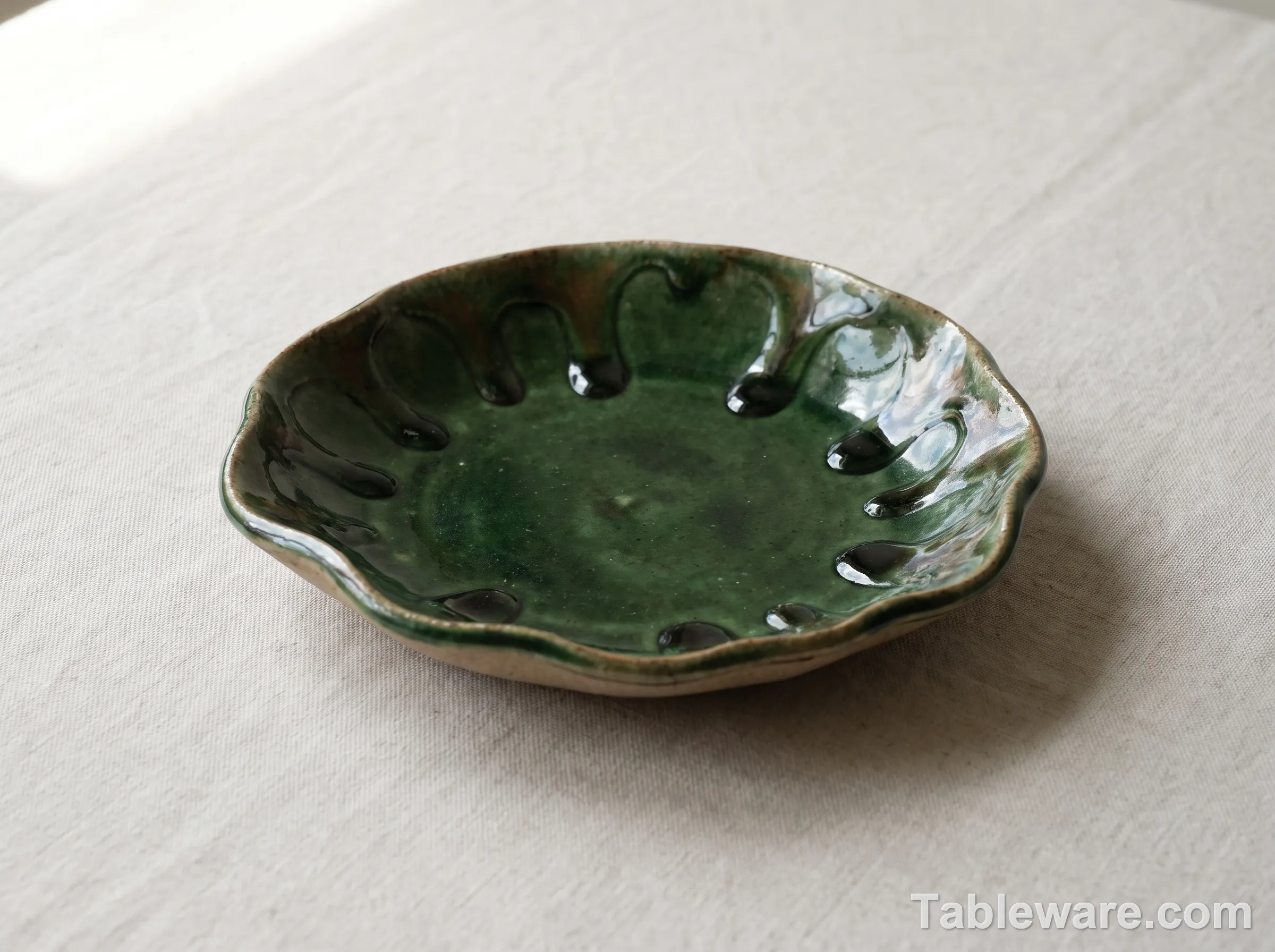 Close-up of an Oribe green glaze with drip patterns